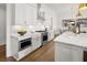 Modern kitchen with white cabinets, stainless steel appliances and hardwood floors at 3709 Tielman St, Snellville, GA 30078