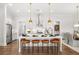 Modern kitchen with stainless steel appliances, white cabinets, large island, and pendant lighting at 3709 Tielman St, Snellville, GA 30078