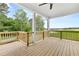 Spacious covered porch featuring wood flooring and a beautiful view of the green golf course at 3709 Tielman St, Snellville, GA 30078