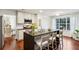 Modern kitchen with large island, stainless steel appliances, and hardwood floors at 64 Whitlock Sq, Marietta, GA 30064