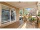 Wooden back porch with large windows and backyard view at 1489 New Hope Rd, Locust Grove, GA 30248