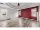 Large bedroom with gray walls and wood-look floors at 1489 New Hope Rd, Locust Grove, GA 30248