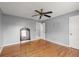 Bedroom with hardwood floors and a ceiling fan at 1489 New Hope Rd, Locust Grove, GA 30248