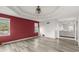 Main bedroom with red accent wall and wood-look floors at 1489 New Hope Rd, Locust Grove, GA 30248