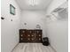 Walk-in closet with wood dresser and shelving at 1489 New Hope Rd, Locust Grove, GA 30248