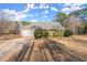 Ranch home with attached garage and large yard at 1489 New Hope Rd, Locust Grove, GA 30248