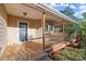 Inviting front porch with wooden deck and railing at 1489 New Hope Rd, Locust Grove, GA 30248