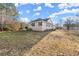 Ranch style home with a large backyard and trees at 1489 New Hope Rd, Locust Grove, GA 30248