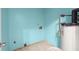 Laundry room with tile floor and a water heater at 1489 New Hope Rd, Locust Grove, GA 30248