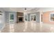 Bright living room with stone fireplace and tile floors at 1489 New Hope Rd, Locust Grove, GA 30248