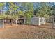 Metal storage shed and covered carport in backyard at 1489 New Hope Rd, Locust Grove, GA 30248