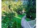 Scenic pathway meanders through lush gardens and tranquil pond at 27306 Plantation Ne Dr, Atlanta, GA 30324