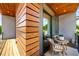 Relaxing outdoor balcony with a small table and chairs, featuring wood finishes at 105 Georgia Se Ave # 5, Atlanta, GA 30312