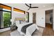 Comfortable bedroom with large windows, a ceiling fan, and modern décor at 105 Georgia Se Ave # 5, Atlanta, GA 30312