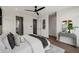 Spacious bedroom featuring a cozy bed, a modern ceiling fan, and a dressing table at 105 Georgia Se Ave # 5, Atlanta, GA 30312
