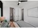 Comfortable bedroom featuring a ceiling fan, art, and doors leading to the bathroom and closet for modern living at 105 Georgia Se Ave # 5, Atlanta, GA 30312