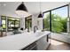 Open-concept kitchen with stainless steel appliances, modern fixtures, and large windows, seamlessly connected to living area at 105 Georgia Se Ave # 5, Atlanta, GA 30312