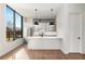 Modern kitchen with white cabinets, island, and stainless steel appliances at 105 Georgia Se Ave # 5, Atlanta, GA 30312