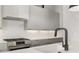 Modern kitchen with sleek grey cabinets and marble backsplash at 105 Georgia Se Ave # 5, Atlanta, GA 30312