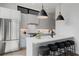 Modern kitchen with sleek countertops, stainless steel appliances, and a stylish breakfast bar with seating for five at 105 Georgia Se Ave # 5, Atlanta, GA 30312