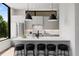 Modern kitchen with sleek white countertops, stainless steel appliances, and stylish pendant lighting over the island at 105 Georgia Se Ave # 5, Atlanta, GA 30312