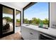 Stylish kitchenette featuring sleek countertops, modern sink, and access to the outdoor balcony at 105 Georgia Se Ave # 5, Atlanta, GA 30312