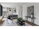 Bright living room with modern furniture, minimalist decor, and open concept kitchen at 105 Georgia Se Ave # 5, Atlanta, GA 30312