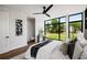 Modern bedroom with large window, hardwood floors, and sleek ceiling fan for a comfortable and stylish retreat at 105 Georgia Se Ave # 5, Atlanta, GA 30312