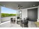 Relaxing outdoor patio space with comfortable seating, overhead fan, and scenic views of the surrounding trees at 105 Georgia Se Ave # 5, Atlanta, GA 30312