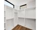 Spacious walk-in closet with wood floor and plenty of shelving and rod space for ample storage and organization at 105 Georgia Se Ave # 5, Atlanta, GA 30312
