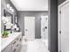 Modern bathroom with marble floors and walk-in shower at 3351 Orwell Way # 2206, Cumming, GA 30041