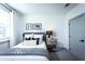 Cozy bedroom with a comfortable bed and nightstand at 3351 Orwell Way # 2206, Cumming, GA 30041