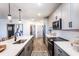 Modern kitchen with gray cabinets and stainless steel appliances at 3351 Orwell Way # 2206, Cumming, GA 30041