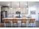 Modern kitchen island with seating and white quartz countertops at 3351 Orwell Way # 2206, Cumming, GA 30041