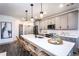 Modern kitchen with gray cabinets and stainless steel appliances at 3351 Orwell Way # 2206, Cumming, GA 30041