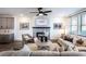 Cozy living room features a fireplace and built-in shelving at 3351 Orwell Way # 2206, Cumming, GA 30041