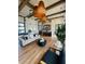 A stylish clubhouse boasts modern lighting, an open living area, and a sleek kitchen with a large island at 7170 Pond View Dr, Cumming, GA 30028