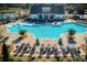 An inviting community pool features a gradual entry, waterslide and lounge chairs for relaxing on sunny days at 7170 Pond View Dr, Cumming, GA 30028