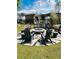 Enjoy outdoor gatherings at the community fire pit with comfortable seating and a charming pergola overhead at 7170 Pond View Dr, Cumming, GA 30028