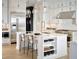 Modern kitchen featuring stainless steel appliances, a large island, and ample cabinet space at 7170 Pond View Dr, Cumming, GA 30028