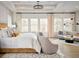 Comfortable Primary bedroom with sitting area, large windows, and soft natural light at 7170 Pond View Dr, Cumming, GA 30028