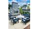 Cozy up by the stone fireplace with comfortable seating in this inviting outdoor lounge area in the community at 7170 Pond View Dr, Cumming, GA 30028