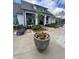 Charming poolside with potted flowers and lounge chairs near the clubhouse are perfect for relaxation and enjoying the community at 7170 Pond View Dr, Cumming, GA 30028