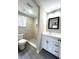 Bathroom with walk-in shower, white vanity, and gray flooring at 10033 Florence Cir, Villa Rica, GA 30180