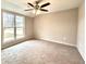 Bright bedroom with carpeted flooring and a large window at 10033 Florence Cir, Villa Rica, GA 30180