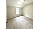 Well-lit bedroom featuring carpet and a window at 10033 Florence Cir, Villa Rica, GA 30180