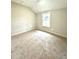 Spacious bedroom with carpeted floor and a window at 10033 Florence Cir, Villa Rica, GA 30180