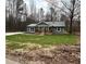 Newly built home with green siding and a large yard at 10033 Florence Cir, Villa Rica, GA 30180