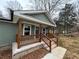 Charming front porch with wooden railings and steps at 10033 Florence Cir, Villa Rica, GA 30180