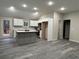 Modern kitchen featuring an island, stainless steel appliances, and white cabinets at 10033 Florence Cir, Villa Rica, GA 30180